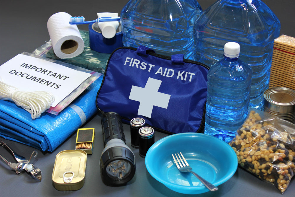 A first aid kit and an emergency kit containing necessary supplies. 